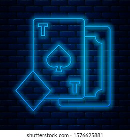Glowing neon line Playing card with spades symbol icon isolated on brick wall background. Casino gambling.  Vector Illustration
