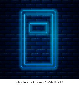 Glowing neon line Police assault shield icon isolated on brick wall background.  Vector Illustration