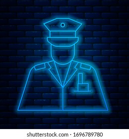 Glowing neon line Police officer icon isolated on brick wall background.  Vector Illustration