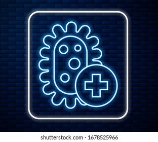 Glowing neon line Positive virus icon isolated on brick wall background. Corona virus 2019-nCoV. Bacteria and germs, cell cancer, microbe, fungi.  Vector Illustration