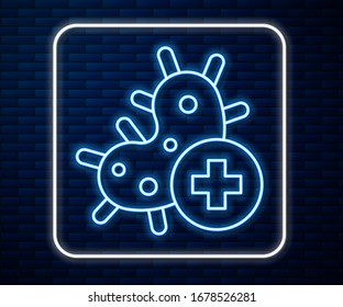 Glowing neon line Positive virus icon isolated on brick wall background. Corona virus 2019-nCoV. Bacteria and germs, cell cancer, microbe, fungi.  Vector Illustration