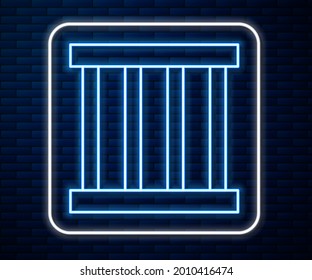 Glowing neon line Prison window icon isolated on brick wall background.  Vector