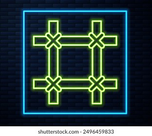 Glowing neon line Prison window icon isolated on brick wall background.  Vector