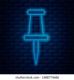 Glowing neon line Push pin icon isolated on brick wall background. Thumbtacks sign.  Vector Illustration