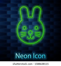 Glowing neon line Rabbit zodiac sign icon isolated on brick wall background. Astrological horoscope collection.  Vector Illustration