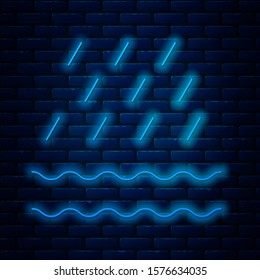 Glowing neon line Rain and waves icon isolated on brick wall background. Rain cloud precipitation with rain drops.  Vector Illustration