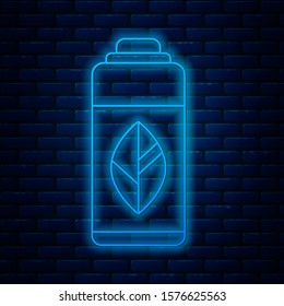 Glowing neon line Recycling plastic bottle icon isolated on brick wall background.  Vector Illustration