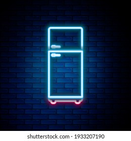 Glowing neon line Refrigerator icon isolated on brick wall background. Fridge freezer refrigerator. Household tech and appliances. Colorful outline concept. Vector