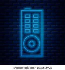 Glowing neon line Remote control icon isolated on brick wall background.  Vector Illustration