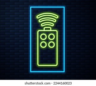 Glowing neon line Remote control for the camera icon isolated on brick wall background. An auxiliary device that allows you to work with a camera from a distance.  Vector