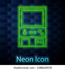 Glowing neon line Retro arcade game machine icon isolated on brick wall background.  Vector Illustration