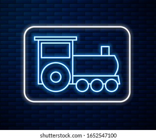 Línea de neón brillante Icono del tren retro aislado en fondo de pared de ladrillo. Símbolo de transporte público.  Ilustración vectorial