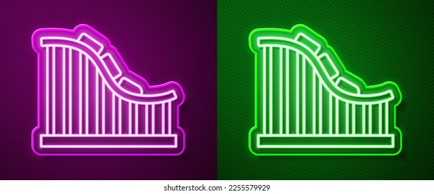 Glowing neon line Roller coaster icon isolated on purple and green background. Amusement park. Childrens entertainment playground, recreation park.  Vector