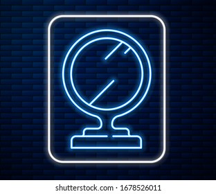 Glowing neon line Round makeup mirror icon isolated on brick wall background.  Vector Illustration