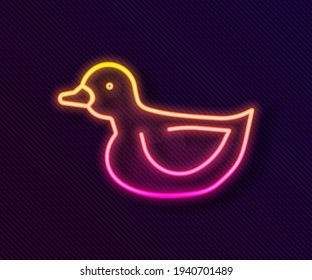 Glowing neon line Rubber duck icon isolated on black background.  Vector