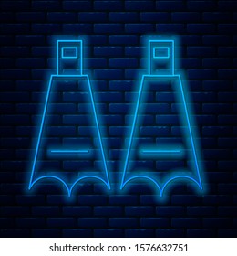 Glowing neon line Rubber flippers for swimming icon isolated on brick wall background. Diving equipment. Extreme sport. Diving underwater equipment.  Vector Illustration