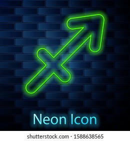 Glowing neon line Sagittarius zodiac sign icon isolated on brick wall background. Astrological horoscope collection.  Vector Illustration