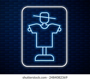 Glowing neon line Scarecrow icon isolated on brick wall background.  Vector