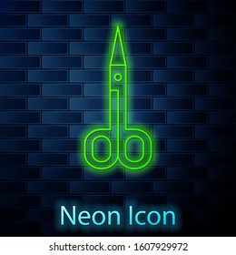 Glowing neon line Scissors icon isolated on brick wall background. Cutting tool sign.  Vector Illustration