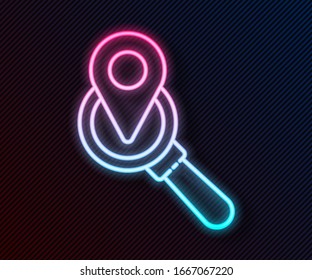 Glowing neon line Search location icon isolated on black background. Magnifying glass with pointer sign.  Vector Illustration