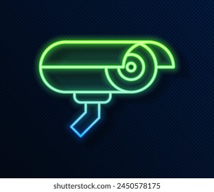 Glowing neon line Security camera icon isolated on blue background.  Vector