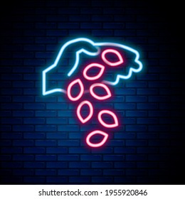 Glowing neon line Seeds of a specific plant icon isolated on brick wall background. Colorful outline concept. Vector