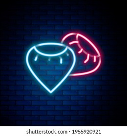 Glowing neon line Seeds of a specific plant icon isolated on brick wall background. Colorful outline concept. Vector