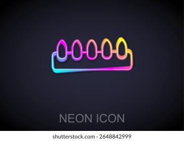Glowing neon line Set of false nails for manicure icon isolated on black background. Varnish color palette for nail extension. Artificial nails.  Vector