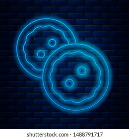 Glowing neon line Sewing button for clothes icon isolated on brick wall background. Clothing buttons.  Vector Illustration