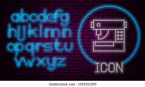 Glowing neon line Sewing machine icon isolated on brick wall background. Neon light alphabet. Vector Illustration