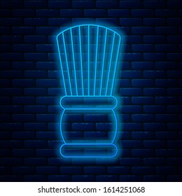 Glowing neon line Shaving brush icon isolated on brick wall background. Barbershop symbol.  Vector Illustration