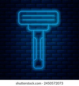 Glowing neon line Shaving razor icon isolated on brick wall background.  Vector