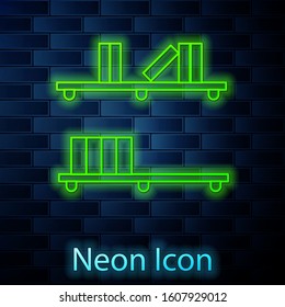 Glowing neon line Shelf with books icon isolated on brick wall background. Shelves sign.  Vector Illustration
