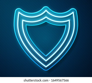 Glowing neon line Shield icon isolated on blue background. Guard sign. Security, safety, protection, privacy concept.  Vector Illustration