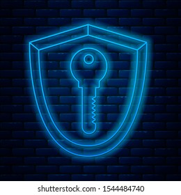 Glowing neon line Shield with key icon isolated on brick wall background. Protection and security concept. Safety badge icon. Privacy banner. Defense tag.  Vector Illustration