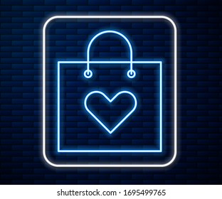 Glowing neon line Shopping bag with heart icon isolated on brick wall background. Shopping bag shop love like heart icon. Valentines day symbol.  Vector Illustration
