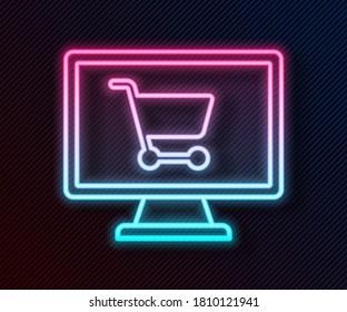 Glowing neon line Shopping cart on screen computer icon isolated on black background. Concept e-commerce, e-business, online business marketing.  Vector Illustration