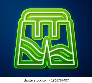 Glowing neon line Short or pants icon isolated on blue background.  Vector