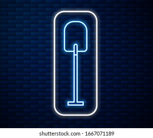 Glowing neon line Shovel icon isolated on brick wall background. Gardening tool. Tool for horticulture, agriculture, farming.  Vector Illustration