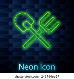 Glowing neon line Shovel and rake icon isolated on brick wall background. Tool for horticulture, agriculture, gardening, farming. Ground cultivator.  Vector