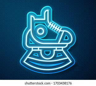 Glowing neon line Skates icon isolated on blue background. Ice skate shoes icon. Sport boots with blades.  Vector Illustration