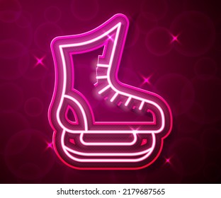 Glowing neon line Skates icon isolated on red background. Ice skate shoes icon. Sport boots with blades.  Vector