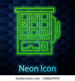 Glowing neon line Slot machine icon isolated on brick wall background.  Vector Illustration