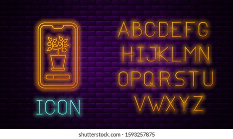 Glowing neon line Smart control farming system mobile application icon isolated on brick wall background. Neon light alphabet. Vector Illustration