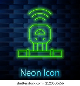 Glowing neon line Smart sensor system icon isolated on brick wall background. Internet of things concept with wireless connection.  Vector