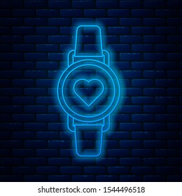 Glowing neon line Smart watch showing heart beat rate icon isolated on brick wall background. Fitness App concept.  Vector Illustration