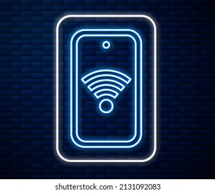 Glowing neon line Smartphone with free wi-fi wireless connection icon isolated on brick wall background. Wireless technology, wi-fi connection, wireless network.  Vector
