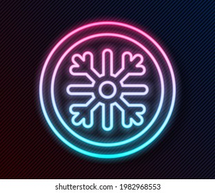 Glowing neon line Snowflake icon isolated on black background.  Vector