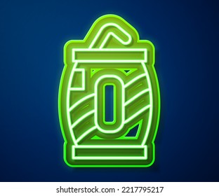 Glowing neon line Soda can with drinking straw icon isolated on blue background.  Vector