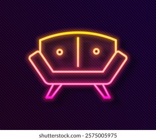 Glowing neon line Sofa icon isolated on black background.  Vector